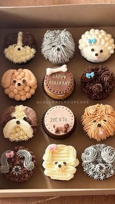 a box filled with lots of cupcakes covered in frosting and icing