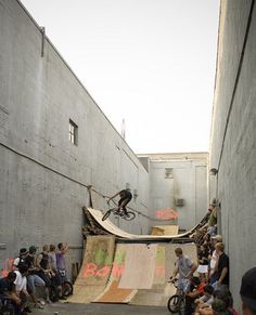 a man riding a skateboard up the side of a ramp
