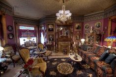 a living room filled with furniture and a chandelier