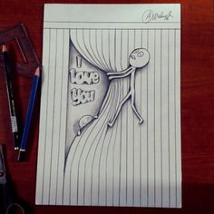 a piece of paper with the words i love you written on it next to scissors and pencils