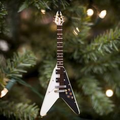 an electric guitar ornament hanging from a christmas tree