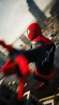 spider - man flying through the air in front of a cityscape