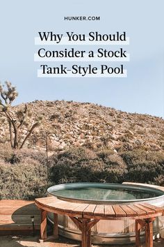 a hot tub sitting on top of a wooden deck next to a mountain with text overlay