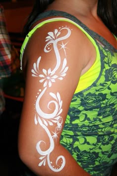 a woman with white paint on her arm