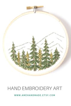 an embroidery pattern with pine trees on it and the words hand embroidery art written below