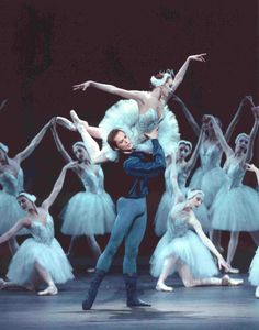 the ballerinas are dressed in white tutus