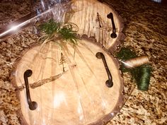 two wooden trays with trees on them sitting on top of a granite countertop