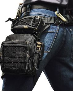 a man in jeans and a black belted waist pack with his back to the camera