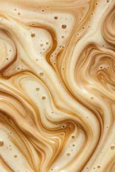 an abstract painting with brown and white swirls