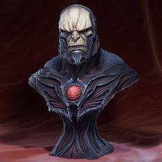 a busturine with a red ball in it's mouth and an evil look on his face