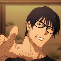 a man with glasses pointing at the camera