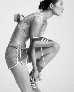 black and white photograph of a woman in shorts