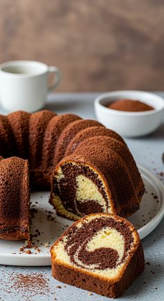 a chocolate bundt cake cut in half on a plate