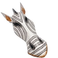 a zebra's head is painted with black and white stripes on the body, it looks like an animal