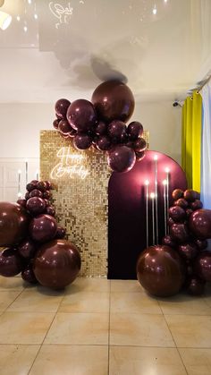 balloons and candles are arranged on the floor