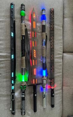 a group of different types of pens sitting on top of a couch next to each other