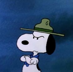 a cartoon dog with a hat and tie on it's head looking at something