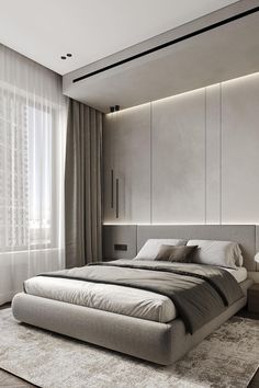 a large bed sitting in the middle of a bedroom next to a window with curtains