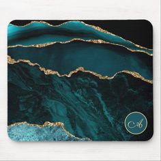 an abstract marble and gold petal design mousepad with the number 6 on it