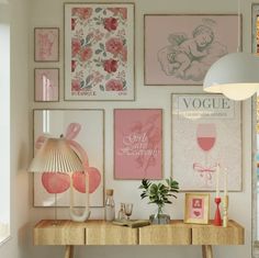 there are many pictures on the wall in this room and one has a table with a lamp next to it