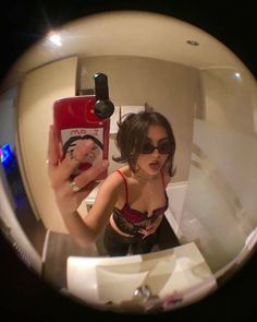 a woman taking a selfie with her cell phone