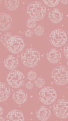 a pink wallpaper with disco balls and stars in the background, as well as an image