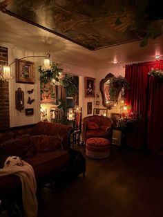 a living room filled with lots of furniture and decor on top of a hard wood floor