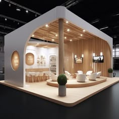 an exhibition stand with white chairs and tables