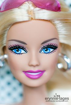 a barbie doll with bright blue eyes and blonde hair, wearing pink lipstick on her lips