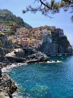 the village is perched on top of a cliff overlooking the ocean