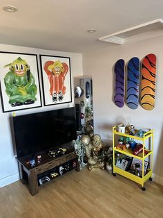 a living room filled with furniture and art on the wall above it is a flat screen tv