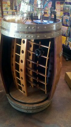 a wooden barrel shaped wine rack in a store