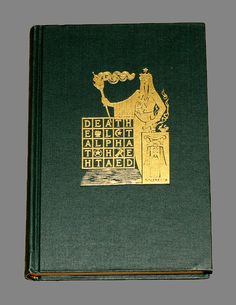 an old book with gold lettering on it