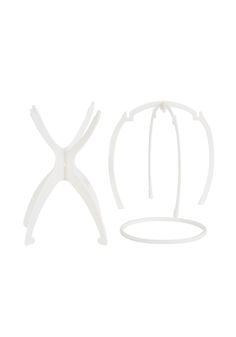 a white plastic object is shown on a white background, with one piece cut out and the other part in half