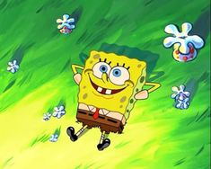spongebob running through the grass with flowers in the background