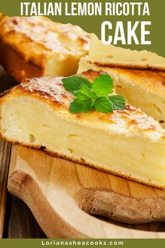 a piece of lemon ricotta cake sitting on top of a wooden cutting board