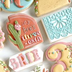 decorated cookies are arranged on a table with the words it's brie's three costa