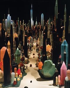 an image of a city with lots of buildings and rocks on the ground at night