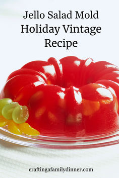 jello salad mold holiday vintage recipe on a clear plate with grapes and lemons