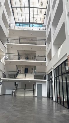 the inside of an empty building with several floors and balconies on each floor
