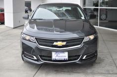 the front end of a black chevrolet vehicle
