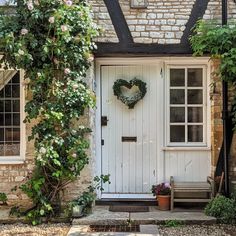 a white door with a heart wreath on it