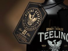 a bottle of teeling is shown with a tag on the front and back of it
