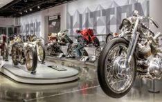 several motorcycles are on display in a museum