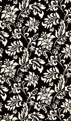 a black and white floral print fabric with large flowers on the side, in front of a ruler