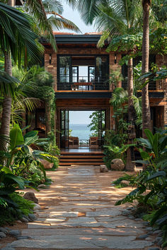 a house with lots of trees and plants around it