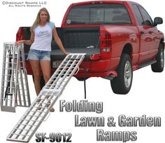 a woman standing next to a red pick up truck with ladders on the bed