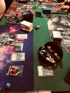 the table is covered with cards and pictures