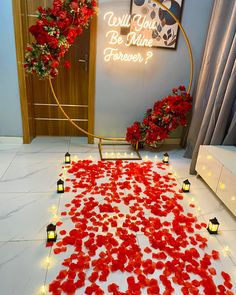 red rose petals laid out on the floor in front of a sign that says be mine forever