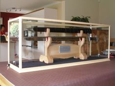 a display case with a skateboard in it on top of a purple table cloth